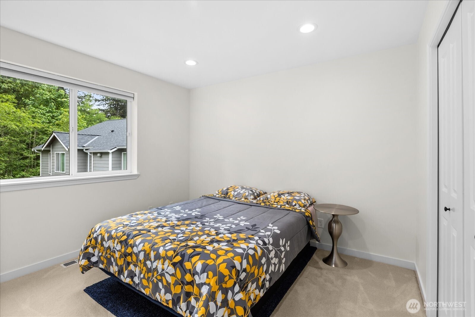 15325 Sunset Road Bothell, WA 98012 - Photo 22 of 40 a bedroom with a bed and a window