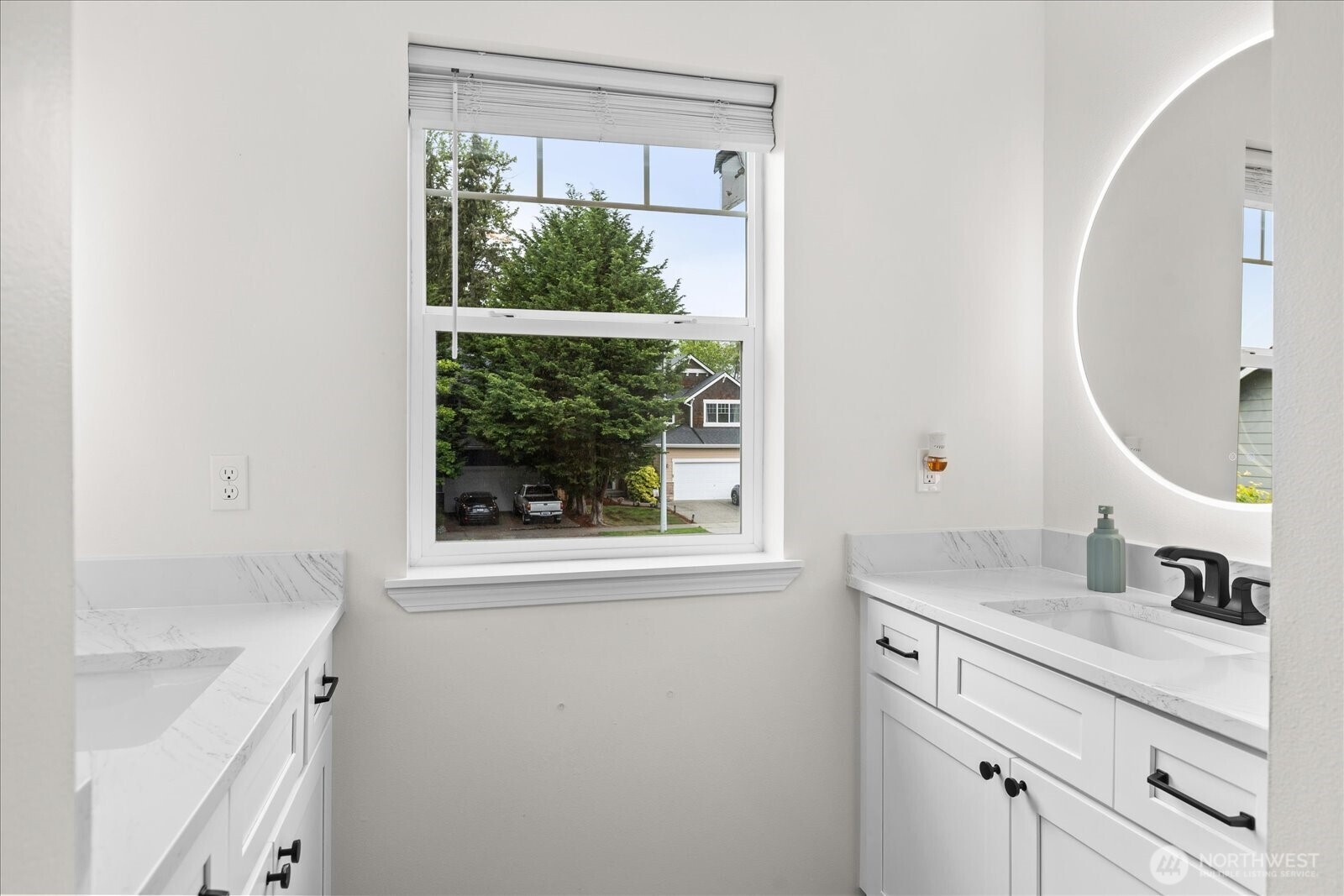 15325 Sunset Road Bothell, WA 98012 - Photo 26 of 40 a bathroom with a sink and a mirror
