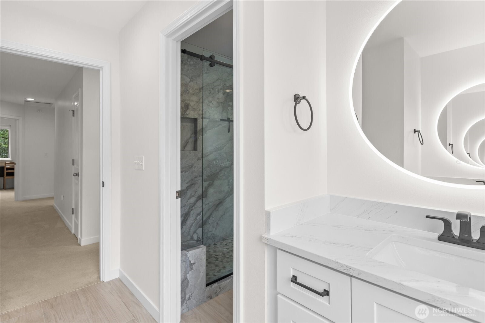 15325 Sunset Road Bothell, WA 98012 - Photo 27 of 40 a en suite bathroom with a granite countertop sink and a mirror