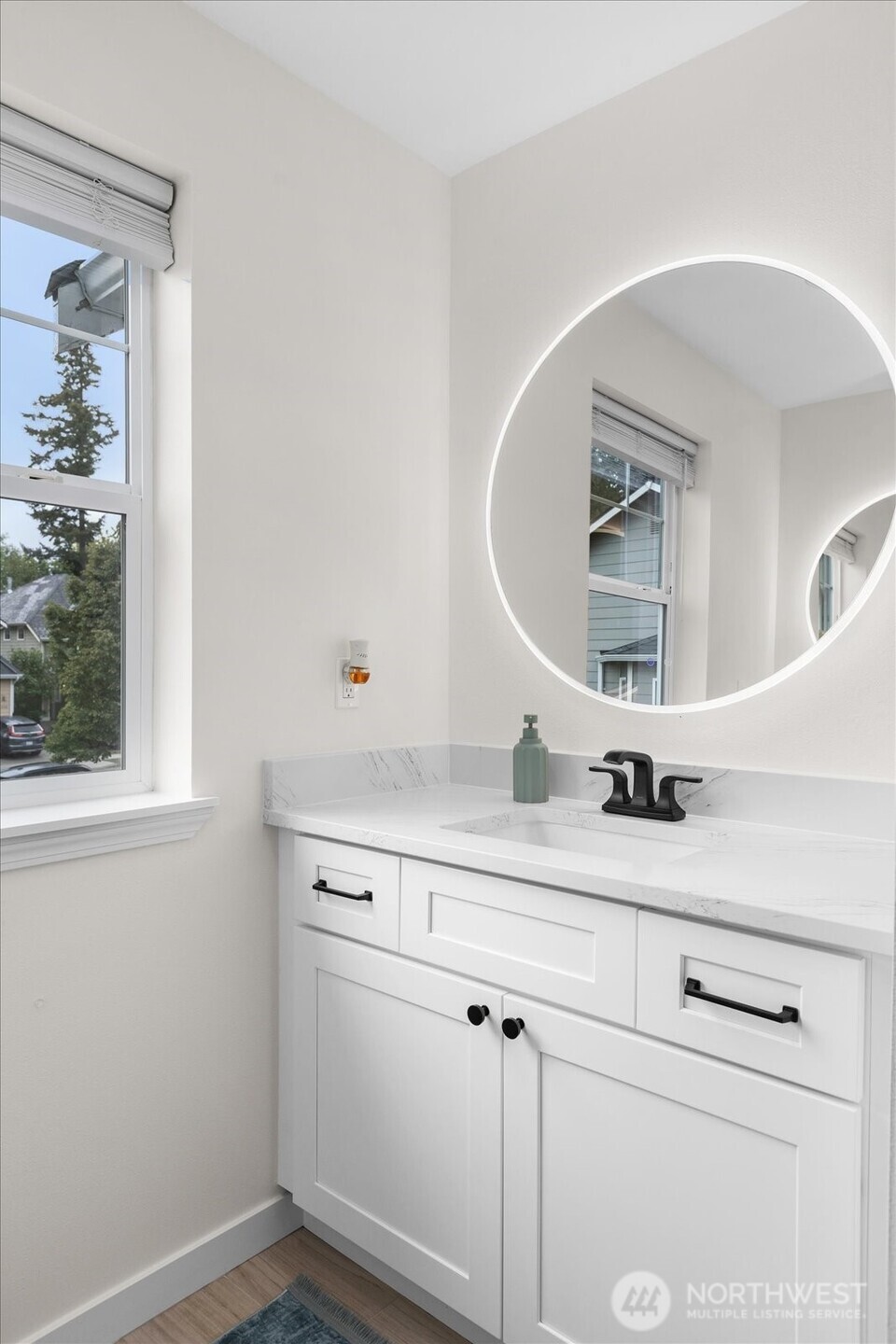 15325 Sunset Road Bothell, WA 98012 - Photo 28 of 40 a bathroom with a sink and a mirror