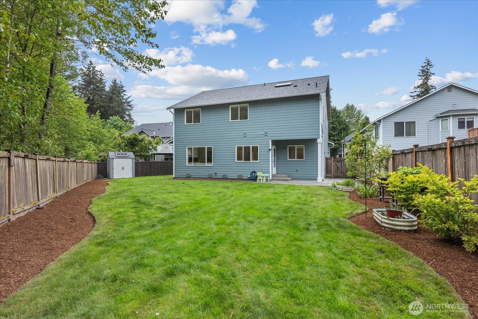 15325 Sunset Road Bothell, WA 98012 - Photo 32 of 40 a house view with a garden space