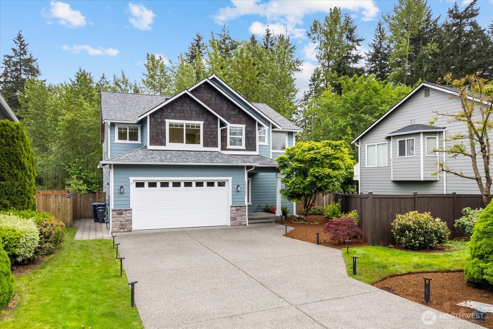 15325 Sunset Road Bothell, WA 98012 - Photo 40 of 40 a front view of a house with a yard and garage