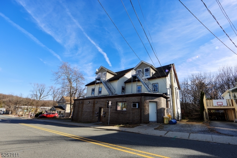 a view of a car park in front of house