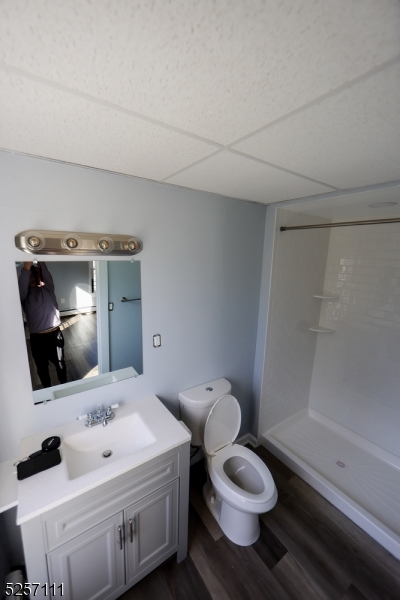 174 Main Street, Unit 2L Franklin, NJ 07416 - Photo 11 of 11 a bathroom with a sink toilet mirror and shower