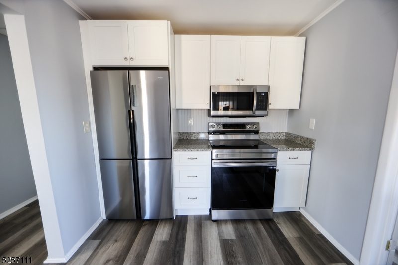 174 Main Street, Unit 2L Franklin, NJ 07416 - Photo 2 of 11 a kitchen with a refrigerator stove and microwave