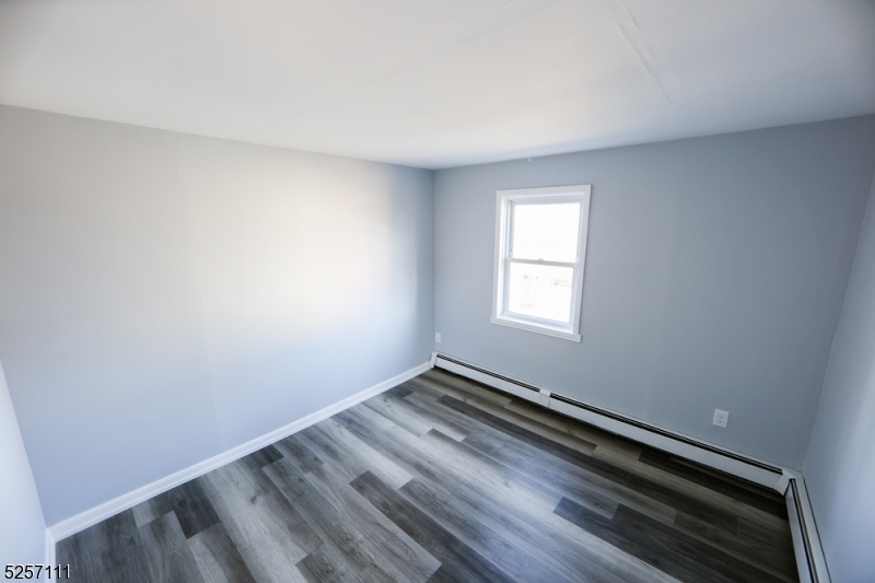 174 Main Street, Unit 2L Franklin, NJ 07416 - Photo 9 of 11 wooden floor in an empty room