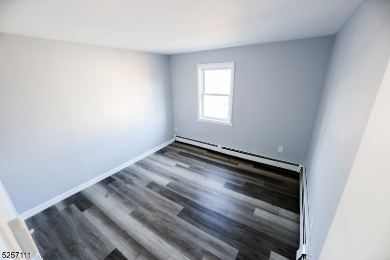 174 Main Street, Unit 2L Franklin, NJ 07416 - Photo 10 of 11 a view of a room with wooden floor and window