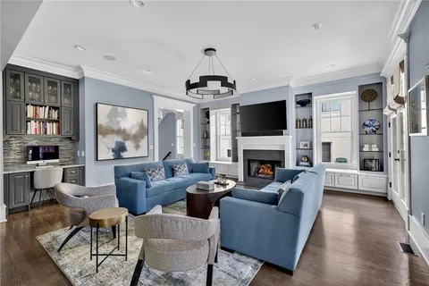 a bathroom with a granite countertop sink toilet mirror and shower