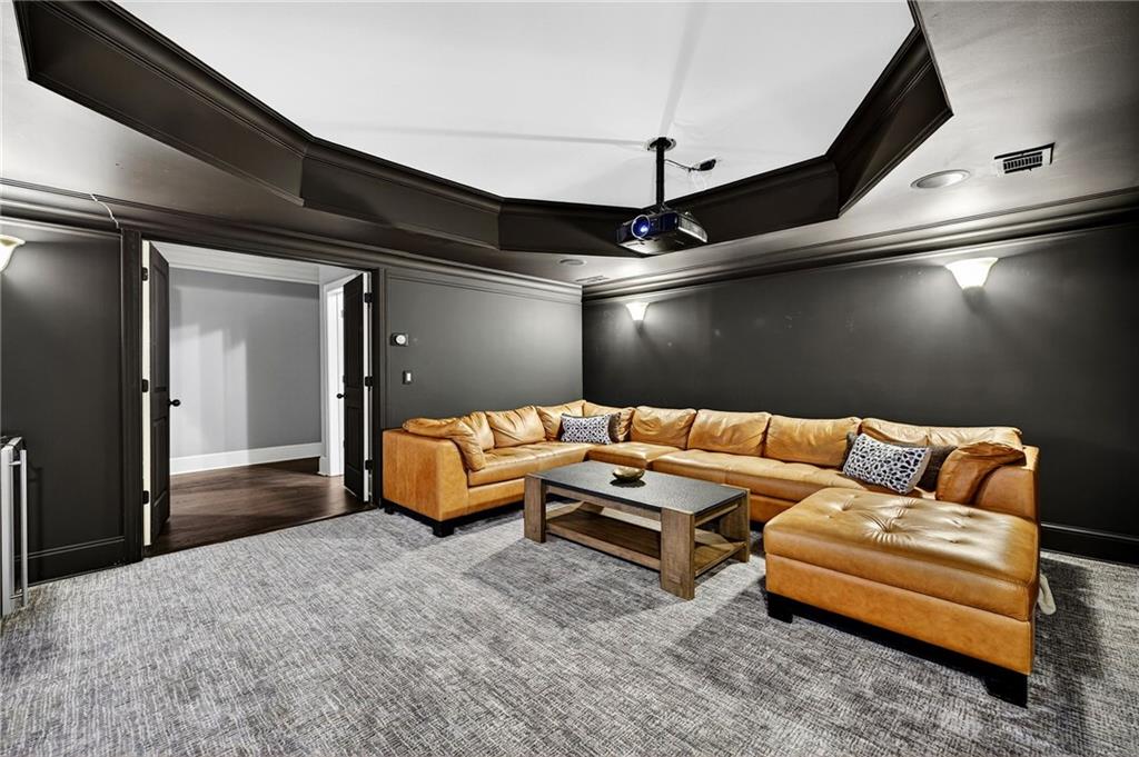 1326 Lanier Boulevard Northeast Atlanta, GA 30306 - Photo 66 of 84 a living room with furniture and a ceiling fan