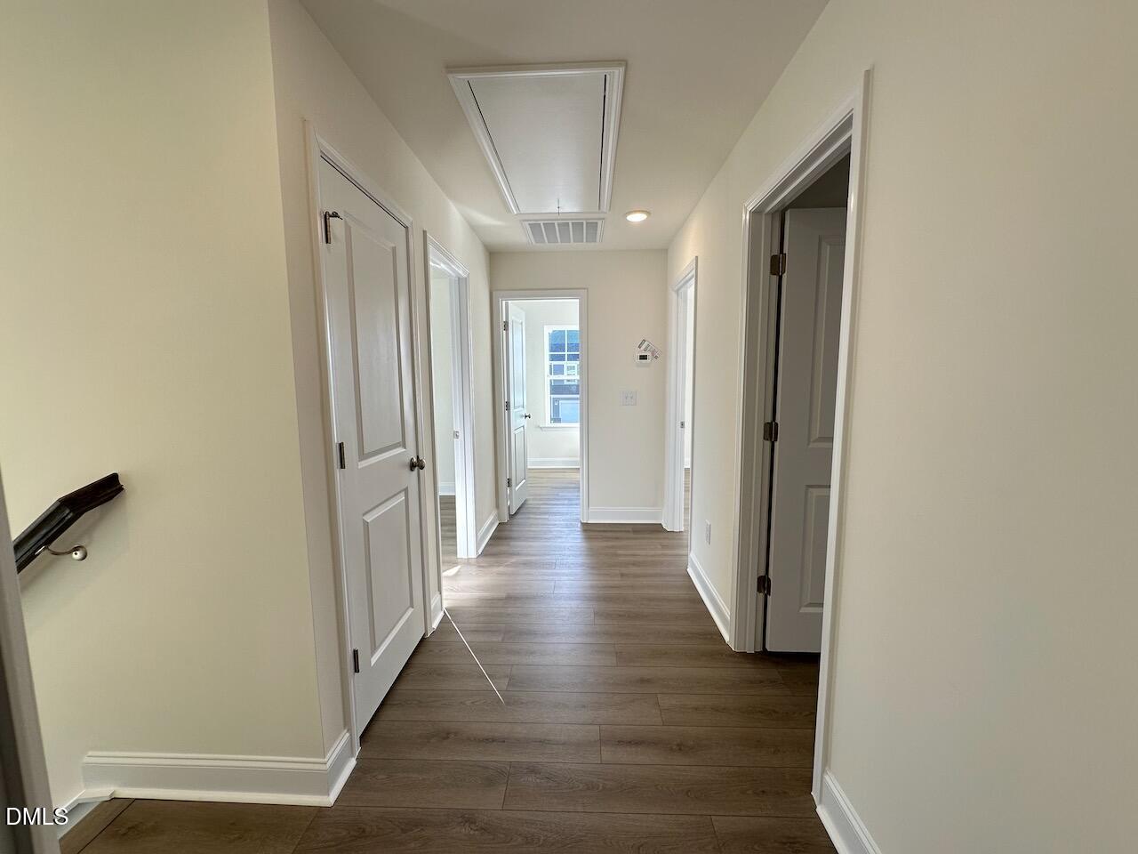 4961 Trout Crst Court Raleigh, NC 27604 - Photo 12 of 25 a view of a hallway with wooden floor