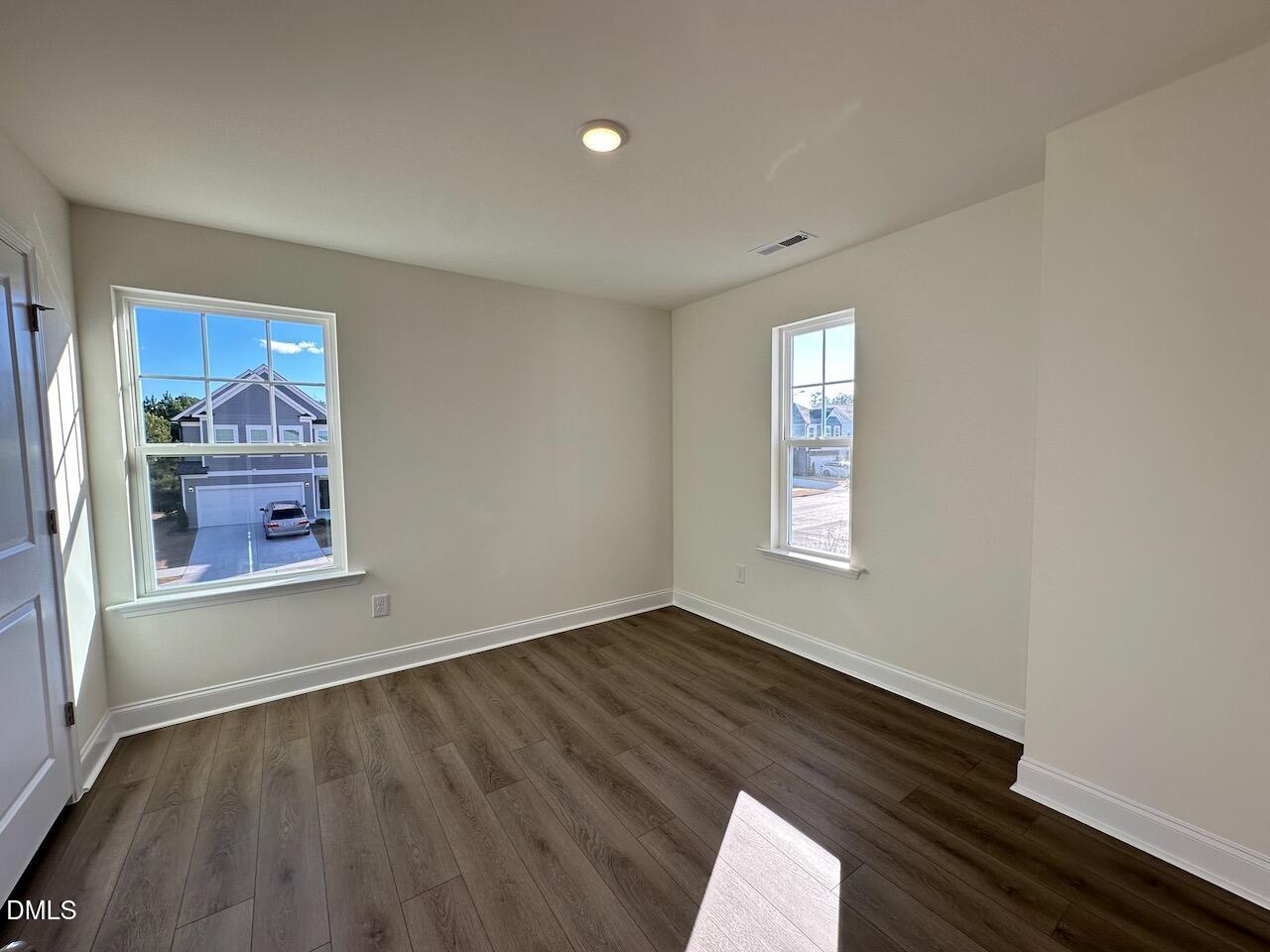 4961 Trout Crst Court Raleigh, NC 27604 - Photo 18 of 25 an empty room with windows