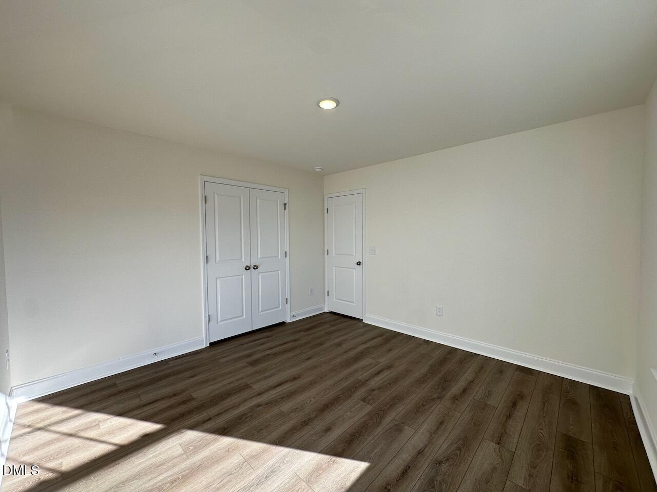 4961 Trout Crst Court Raleigh, NC 27604 - Photo 20 of 25 a view of an empty room and wooden floor