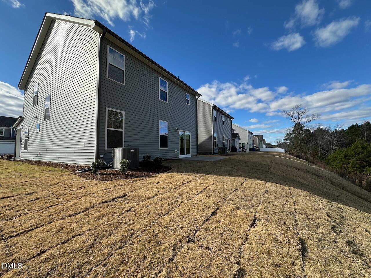 4961 Trout Crst Court Raleigh, NC 27604 - Photo 25 of 25 a view of house with backyard and trees in the background