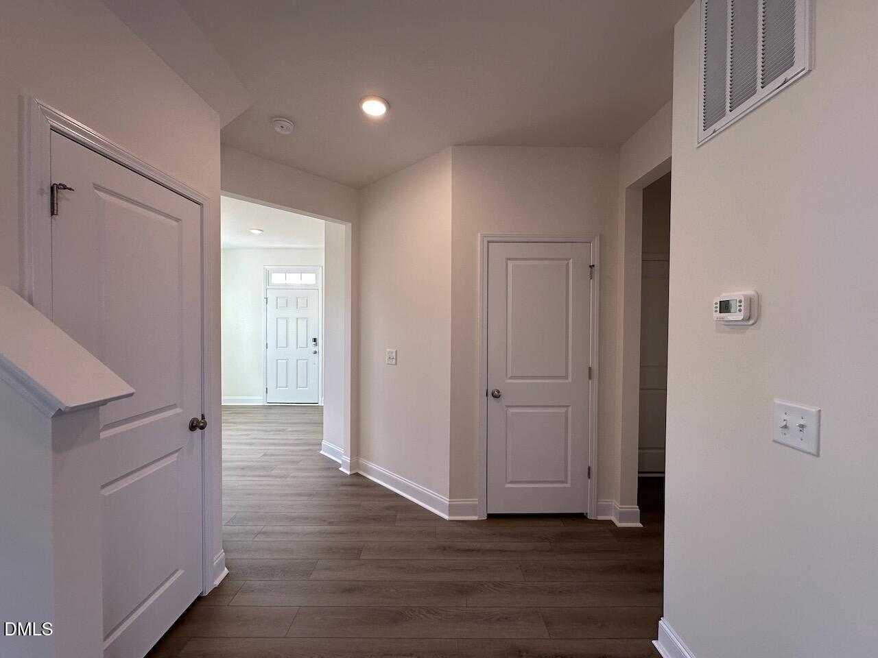 4961 Trout Crst Court Raleigh, NC 27604 - Photo 5 of 25 a view of a hallway with wooden floor
