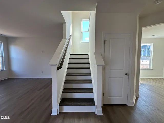 a view of entryway with wooden floor