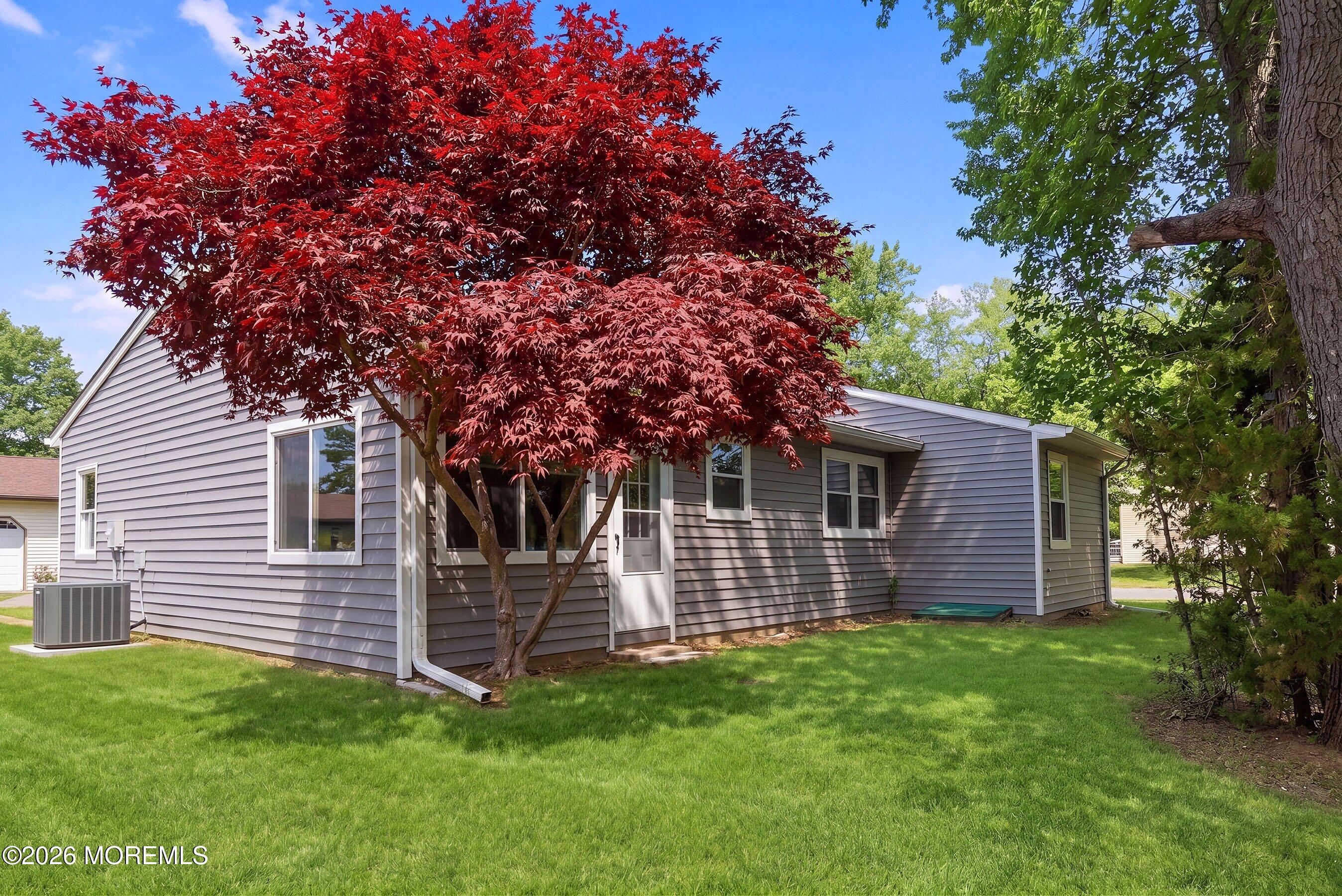 2 Berry Hill Road, Unit 72 Whiting, NJ 08759 - Photo 21 of 43 a view of a house with a backyard