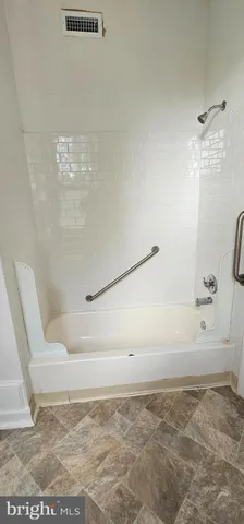 a view of bathtub in shower