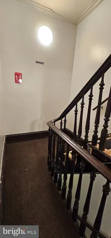 a view of staircase with lots of white walls