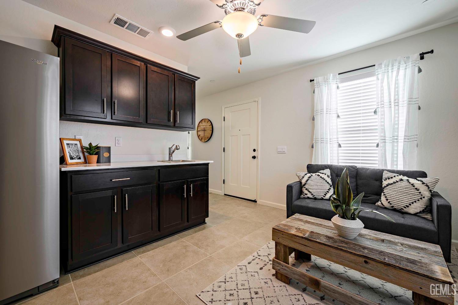 Undisclosed Address Bakersfield, CA 93313 - Photo 13 of 34 a living room with furniture and flat screen tv