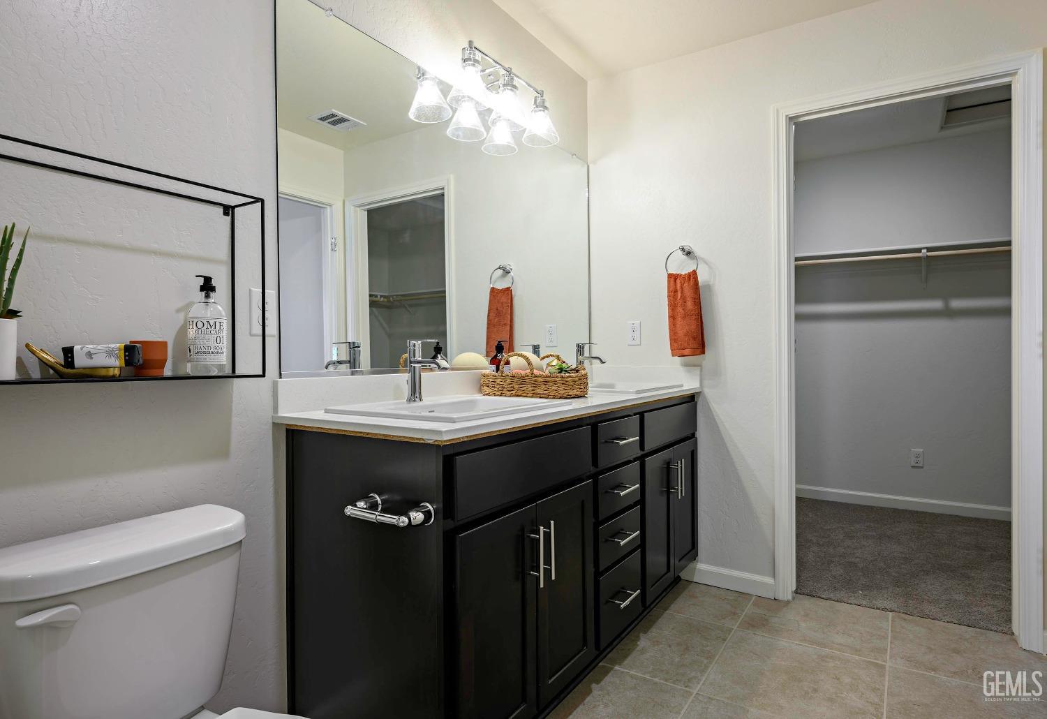 Undisclosed Address Bakersfield, CA 93313 - Photo 19 of 34 a bathroom with a sink vanity granite and a mirror