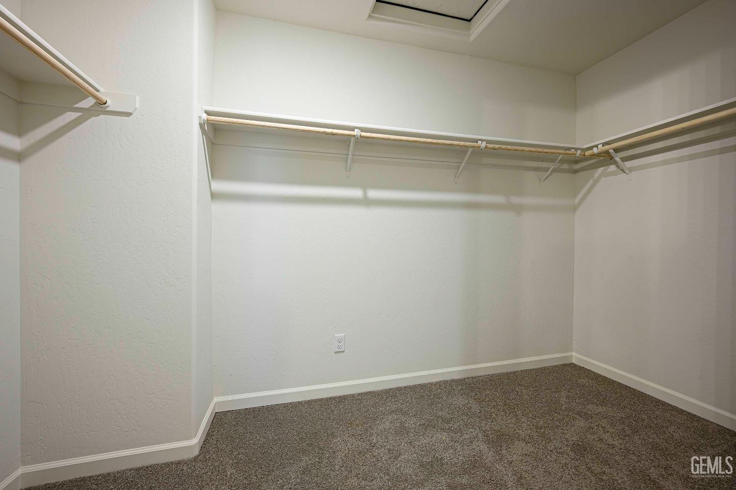 Undisclosed Address Bakersfield, CA 93313 - Photo 20 of 34 a view of an empty walk in closet