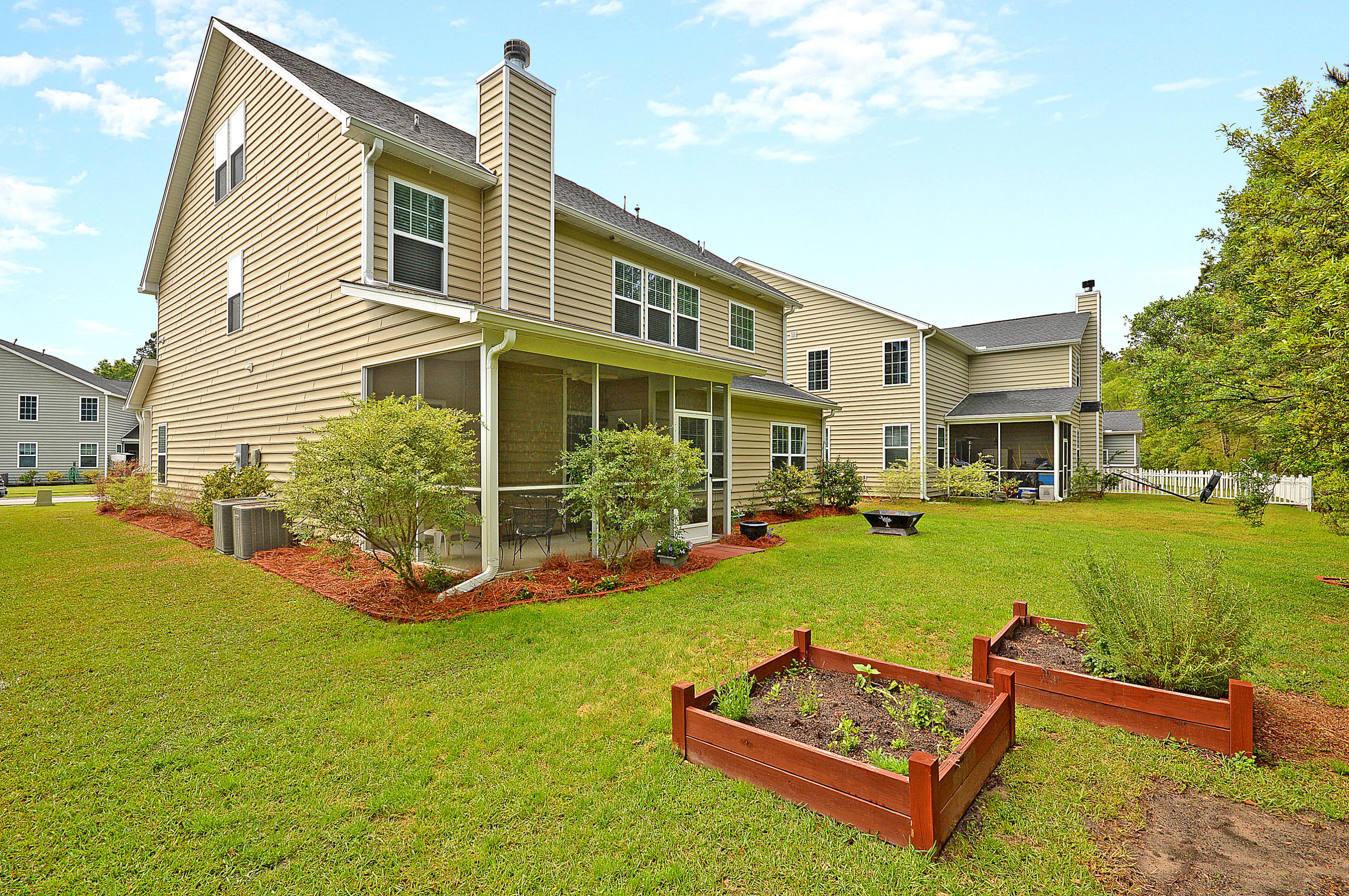 206 Buttonbush Court Moncks Corner, SC 29461 - Photo 4 of 33 Side/back with planters