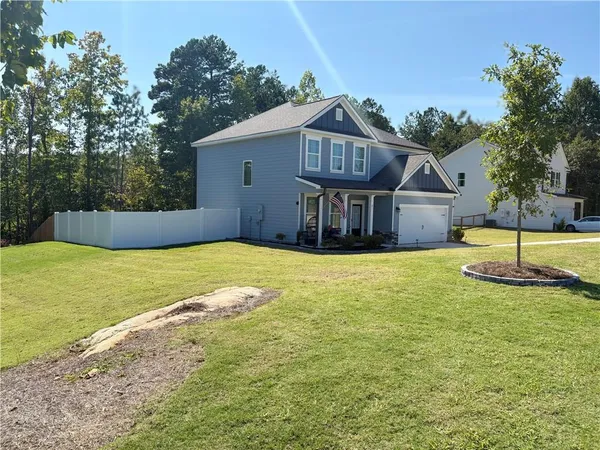 a front view of a house with a yard