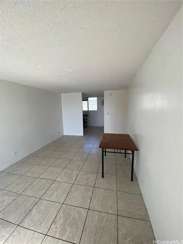 a view of a room with a bench and a chair