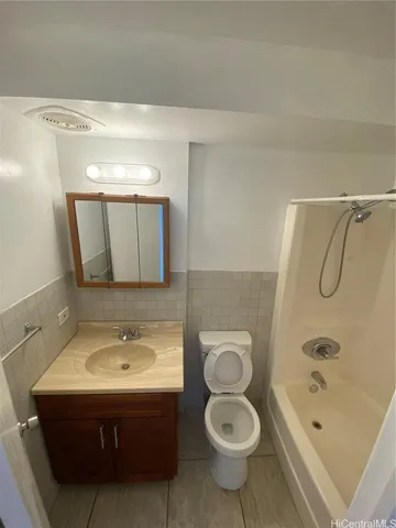 a bathroom with a sink toilet a shower and bathtub