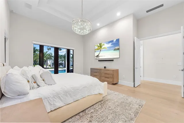 a bedroom with a large bed and a window