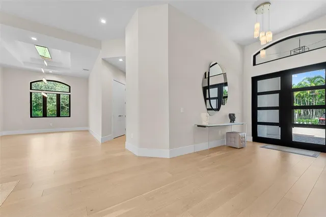 an empty room with windows and entrance