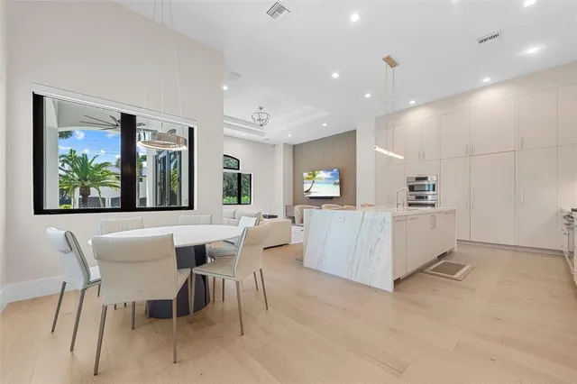 a view of a dining room with furniture and window
