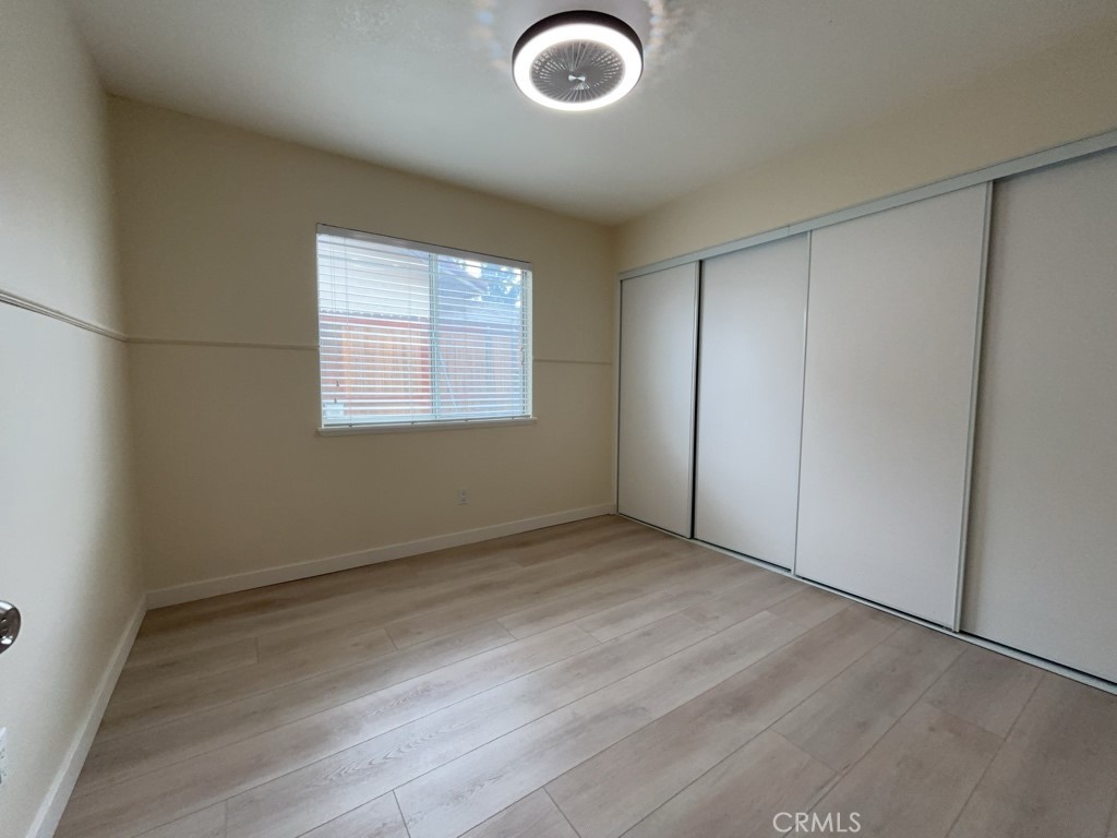 9263 Owari Lane Riverside, CA 92508 - Photo 11 of 17 an empty room with windows and closet