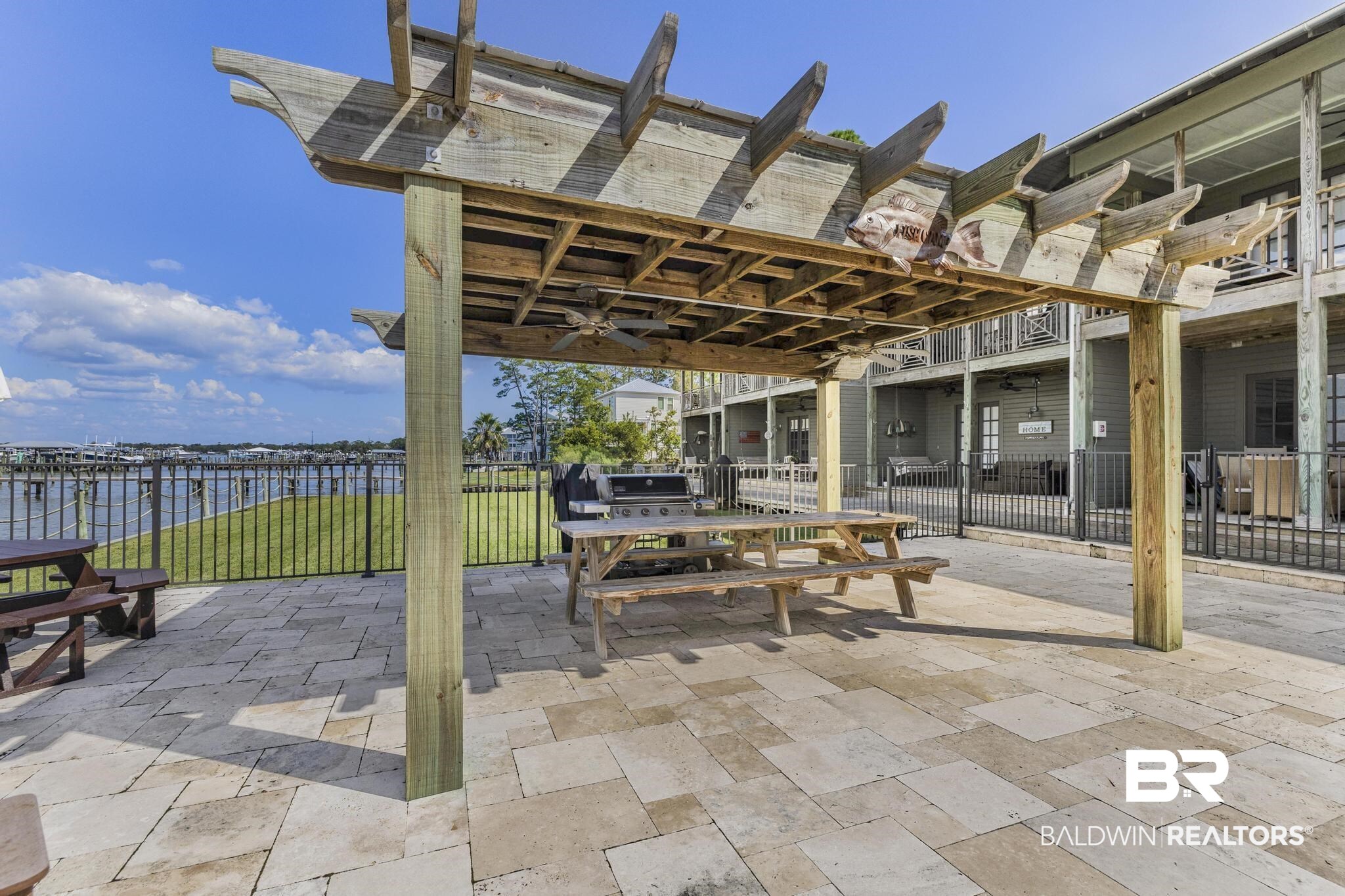 25773 Canal Road Orange Beach, AL 36561 - Photo 30 of 32 View of patio / terrace with ceiling fan and a water view