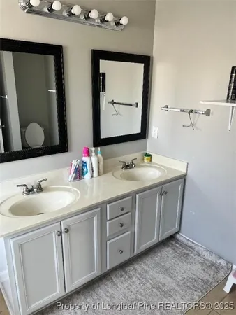 a bathroom with a toilet and a sink