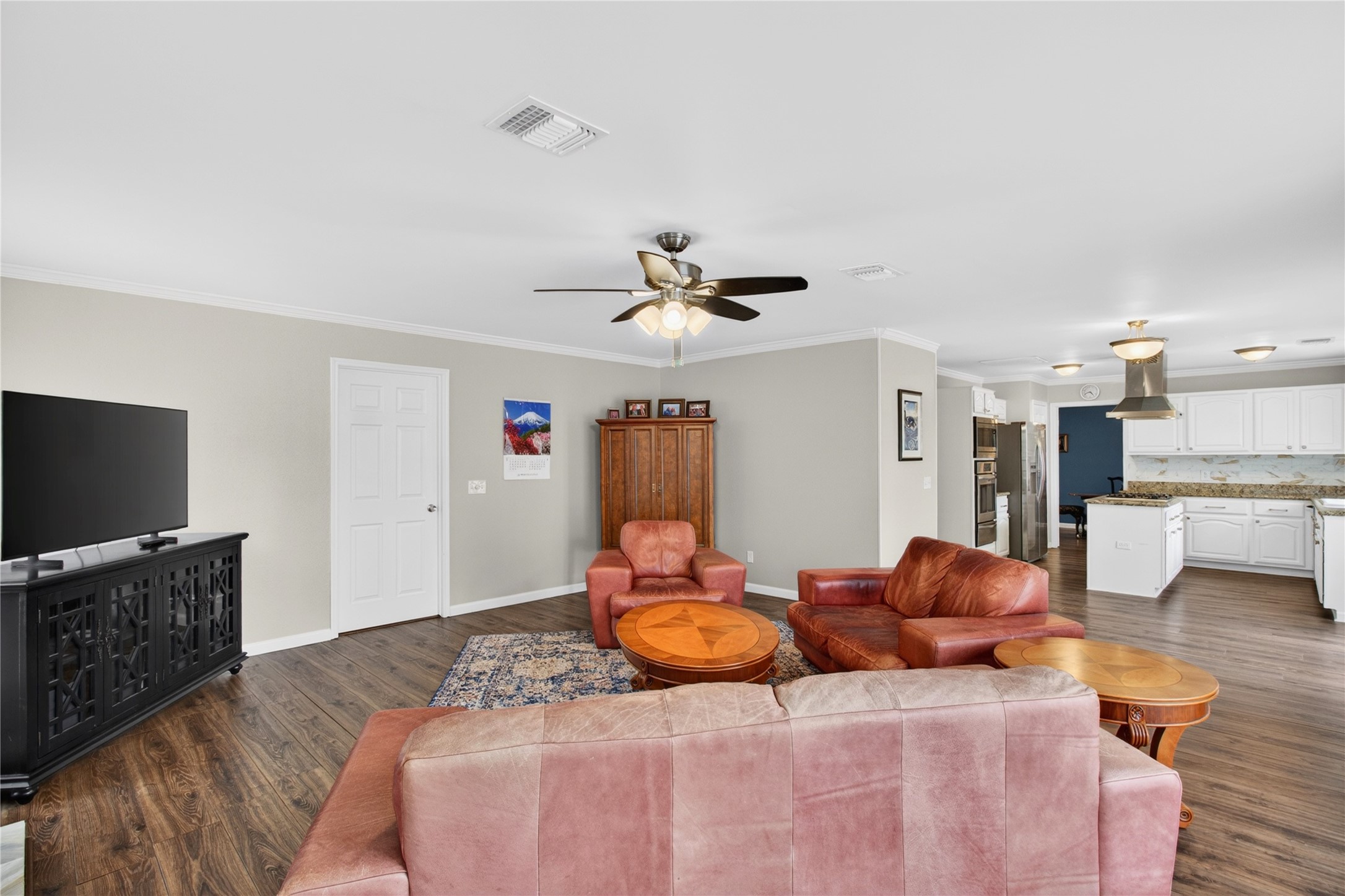 20214 Woodsboro Court Spring, TX 77388 - Photo 21 of 50 Family Room w/Recently Updated Wood-burning Fireplace w/gas connection! Doorway to Laundry Rm & Extra Rm connecting to Garage! Recently Painted Interior! Luxury Vinyl Plank throughout 1st Floor!