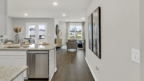 a kitchen with sink and refrigerator