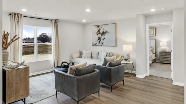 a living room with furniture and windows