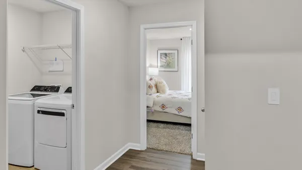 a view of bedroom with wooden floor