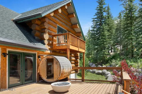 a view of a house with backyard porch and sitting area