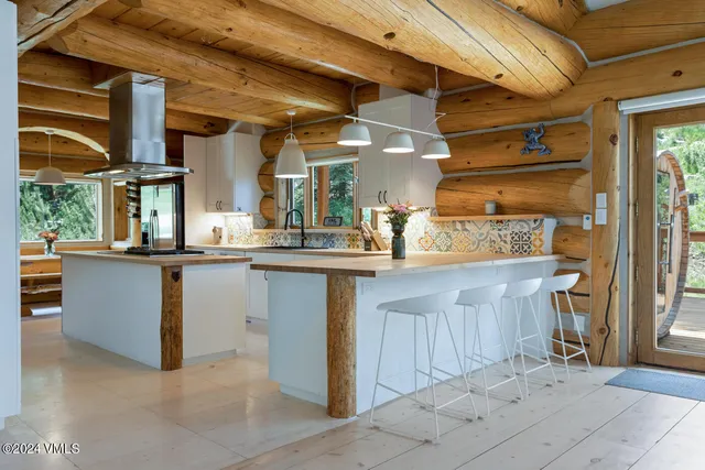 a view of a kitchen with furniture and a kitchen