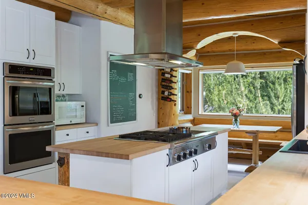 a kitchen with stainless steel appliances granite countertop a stove and a sink