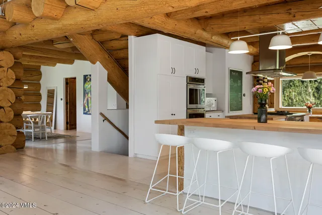 a lobby with a table and chairs