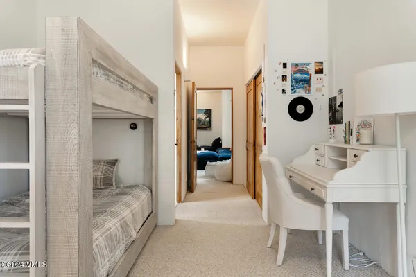 a bedroom with a bed and a view of bathroom