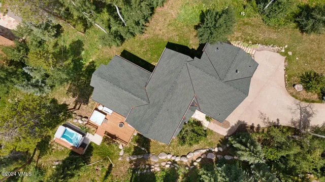 an aerial view of house with yard