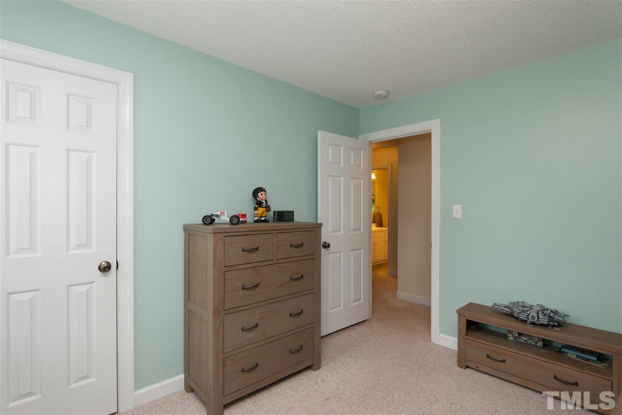 124 Huntsmoor Lane Cary, NC 27513 - Photo 14 of 25 a view of room with cabinet cabinet and mirror