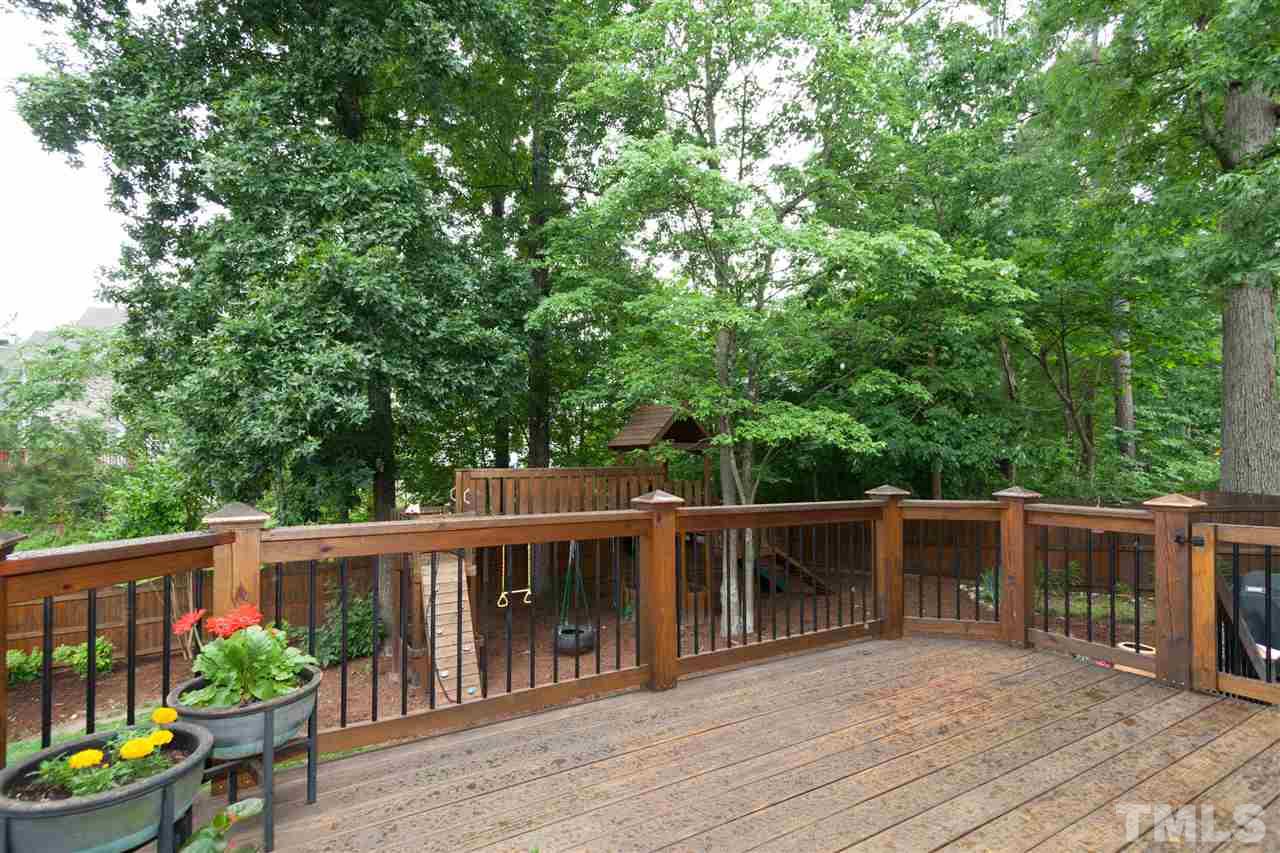 124 Huntsmoor Lane Cary, NC 27513 - Photo 23 of 25 a view of a chairs and table in the wooden deck