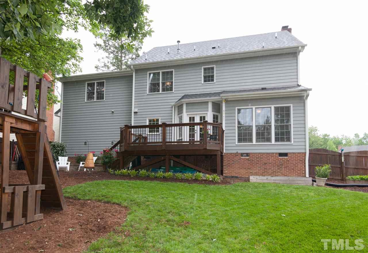 124 Huntsmoor Lane Cary, NC 27513 - Photo 24 of 25 a house view with a garden space