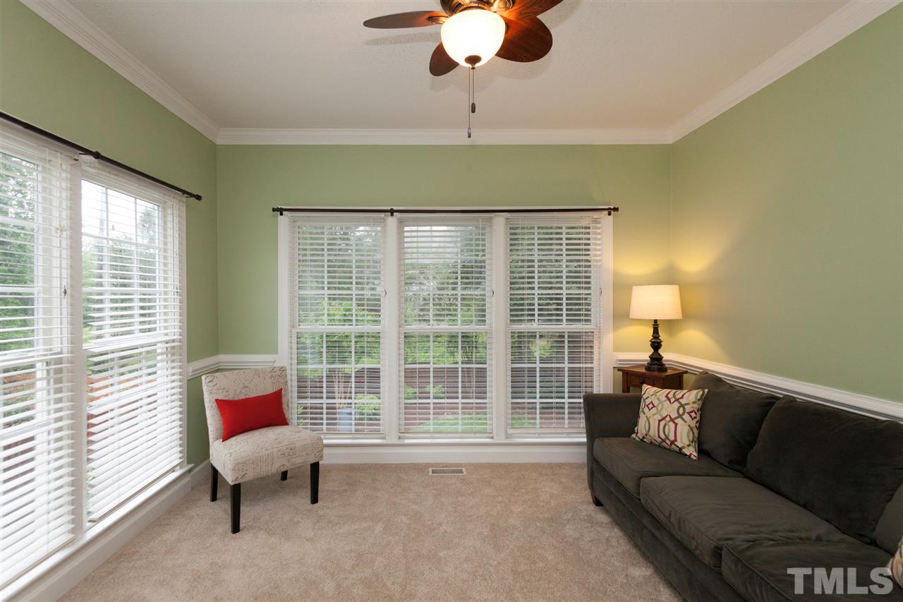 124 Huntsmoor Lane Cary, NC 27513 - Photo 4 of 25 a living room with furniture and a window