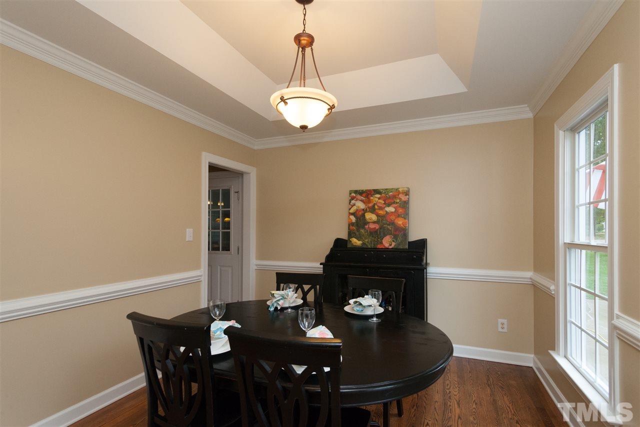 124 Huntsmoor Lane Cary, NC 27513 - Photo 5 of 25 a view of a dining room with furniture and wooden floor